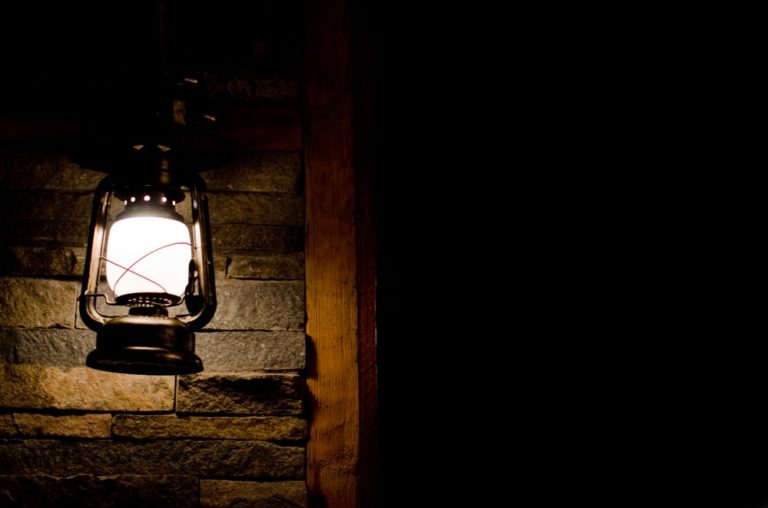 Shining lantern in complete darkness