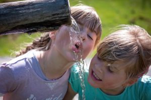 homemade water filter girls drinking