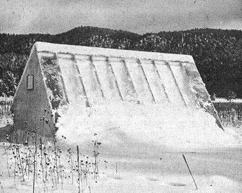 snow covered greenhouse