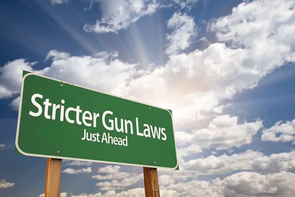 Stricter Gun Laws Green Road Sign With Dramatic Clouds And Sky M D
